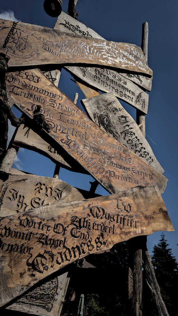 Metre-high engraved stand with the line-up of the House of the Holy Festival