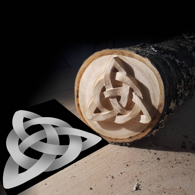 Triskele as a heightmap graphic and a photo of the wooden art object milled from it.