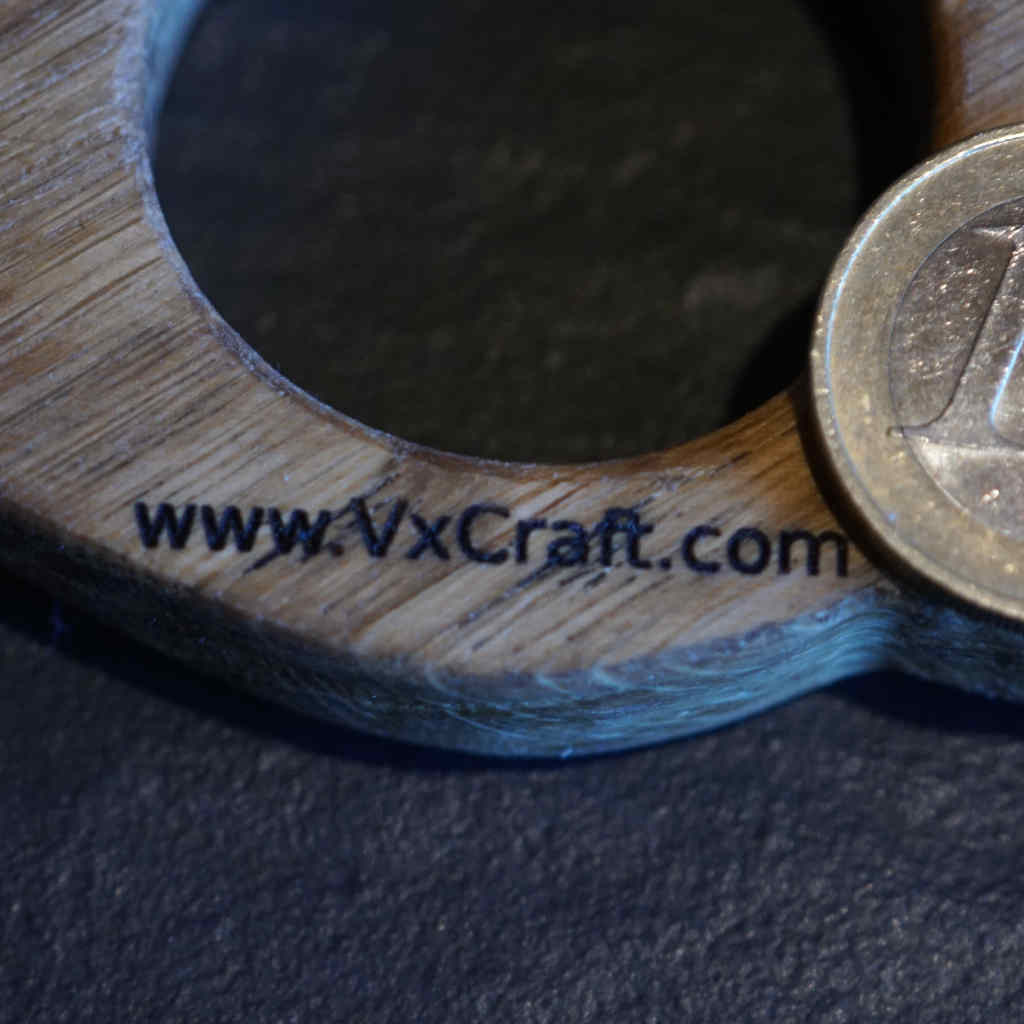 The website www.vxcraft.com as engraving detail on a Winrack. Euro coin as a size comparison.