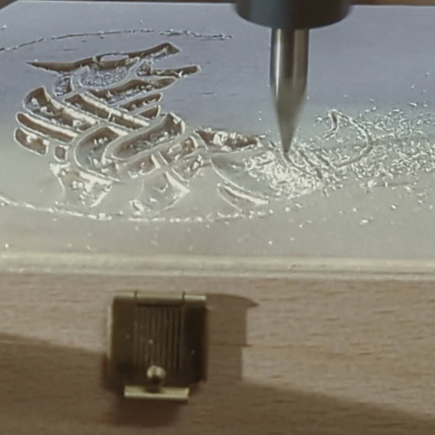 Engraving of a Wolf logo during the milling process.